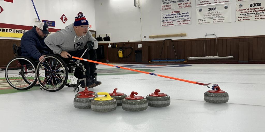 Steve Emt throws a stone during curling practice with other members of Team USA at the Kettle Moraine Curling Club. The Army Veteran is a two-time Paralympian as well as a motivational speaker.