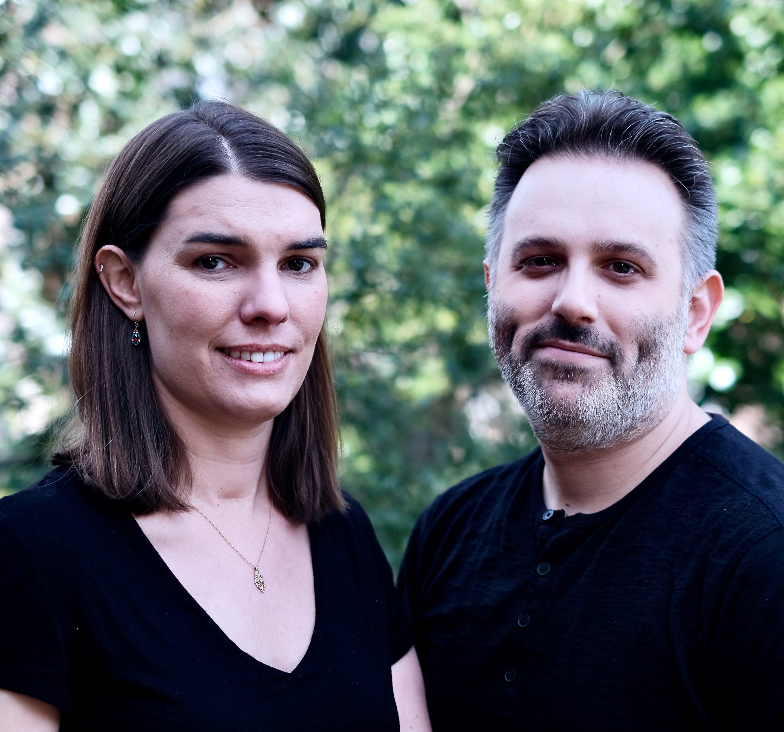 Image of Jacy Good on the left, and Steve Johnson on the right in front of a background of trees.