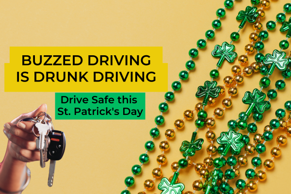 A hand holding a set of car keys is shown on the left side of the image. The background is yellow, and on the right side, there are green and gold beaded necklaces with shamrock shapes, symbolizing St. Patrick's Day. The text on the image reads: 'BUZZED DRIVING IS DRUNK DRIVING' in bold black letters on a yellow background, and 'Drive Safe this St. Patrick's Day' in black letters on a green background.