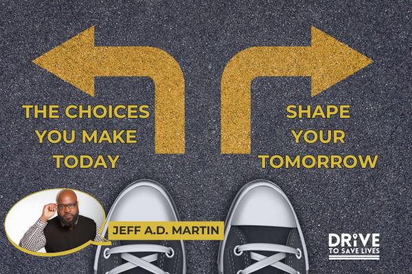 The image is a promotional graphic for a featured blog from speaker Jeff A.D. Martin on the topic of choices. It features a background image of a road with an arrow pointing left and right, and shoes at the bottom of the image. The text "THE CHOICES YOU MAKE TODAY, SHAPE YOUR TOMORROW" is prominently displayed in bold letters, with "DRIVE TO SAVE LIVES" written below.