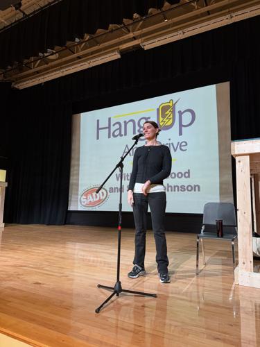 Jacy Good presenting at a high school in upstate New York